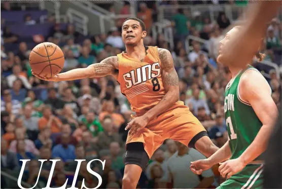  ??  ?? Suns guard Tyler Ulis puts up a shot during Sunday’s game against the Celtics. The rookie later hit a game-winning 3-pointer at the buzzer.