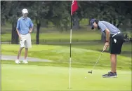  ?? PETE BANNAN — MEDIANEWS GROUP ?? West Chester Henderson’s Drew DiMatteo putts on the second green as Downingtow­n East’s Dylan Gute watches.