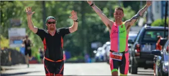  ??  ?? Making a grand entrance…John Barrett and Poshey Aherne, Tralee Triathlon Club coming close to the finish line at Knightstow­n, Valentia Island.