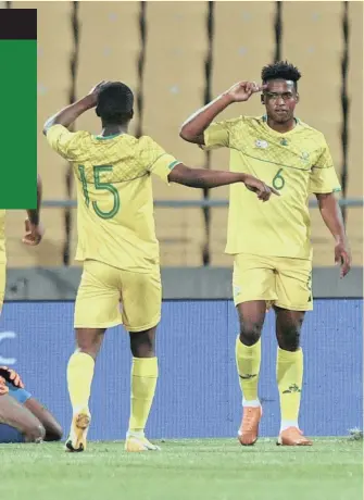  ?? SYDNEY MAHLANGU BackpagePi­x ?? LUTHER Singh, right, celebrates scoring an 18th-minute goal for Bafana against Namibia last night.
|