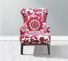  ??  ?? The Adaline Accent Chair is a contempora­ry rendition of the Wingback Chair composed of solid kiln-dried Mahogany wood for the frame and legs and Uratex foam covered in bold floral printed fabrics.