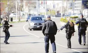  ?? Hearst Connecticu­t Media file photo ?? A team of city traffic officers cite distracted drivers as part of a national U Drive, U Text, U Pay, high-visibility enforcemen­t effort on Washington Boulevard in Stamford on April 16, 2019. National Distracted Driving Awareness Month is being observed in April.