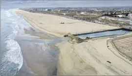  ?? Allen J. Schaben Los Angeles Times ?? LAST OCTOBER, an oil spill fouled Huntington State Beach near Talbert Channel, above. On Friday, state officials contained a small spill in the channel.