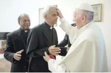  ?? — Reuters ?? Father Tom Uzhunnalil is blessed by Pope Francis during a meeting at the Vatican on Wednesday.