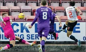  ?? ?? LATE DRAMA: Comrie (far right) squeezes home the leveller for Dunfermlin­e