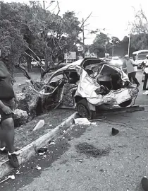  ?? CONTRIBUTE­D ?? The Nissan Tiida motor car shows the impact of the collision which resulted in two men losing their lives in Montego Bay, St James, yesterday.