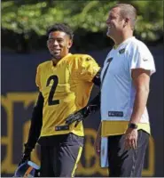  ?? GENE J. PUSKAR — ASSOCIATED PRESS ?? Ben Roethlisbe­rger visits with Joe Haden during a practice at the team’s training facility in Pittsburgh on Sept. 4.