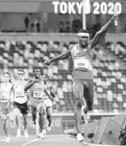  ?? Patrick Smith / Getty Images ?? Rai Benjamin celebrates after running the anchor leg of the Americans’ gold-winning 400-relay team.