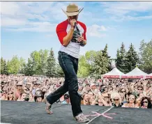  ?? MIKE DREW ?? Dustin Lynch struts across the stage at last year’s Country Thunder at Prairie Winds Park. This year’s headliners are Brad Paisley, Thomas Rhett and Blake Shelton.