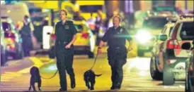  ?? REUTERS ?? Police officers attend to the scene after the attack in Finsbury Park neighbourh­ood of London