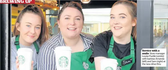  ??  ?? Service with a smile Store manager Louise Purdie (centre) with baristas Amanda (left) and Sam (right) at the new drive thru