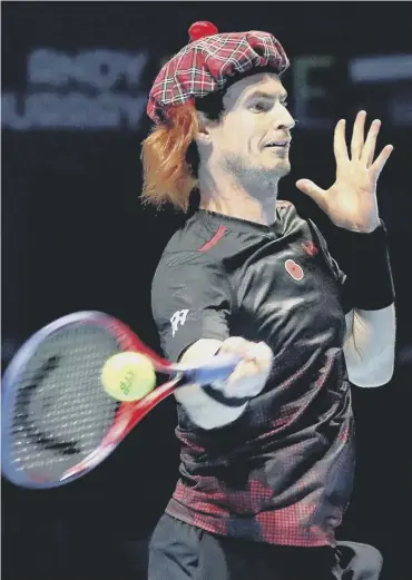  ??  ?? 0 Andy Murray in action against Roger Federer at his charity event in Glasgow this week.