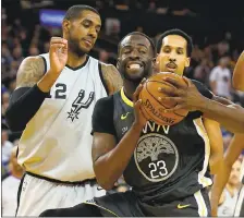  ?? ANDA CHU — STAFF PHOTOGRAPH­ER ?? The Warriors’ Draymond Green (23) grabs a rebound against the Spurs’ LaMarcus Aldridge on Saturday during Golden State’s 122-105victory.