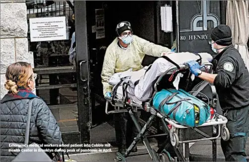  ?? AP ?? Emergency medical workers wheel patient into Cobble Hill Health Center in Brooklyn during peak of pandemic in April.