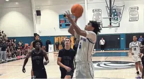  ?? RICK ROBB/SPECIAL TO THE POST ?? Wellington’s Jeremy Tovar drives for a layup during the second half against Palm Beach Central on Thursday night in a District 8-7A semifinal game.