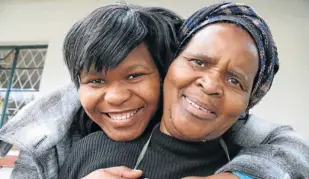  ?? Picture: DAVID MACGREGOR ?? ECSTATIC: Things may have been financiall­y tough for 21-year-old Rhodes student Nozuko Ngqiyaza and her domestic worker mother Violet but this has not stopped her from scooping a top Rhodes University bursary in memory of the late community...