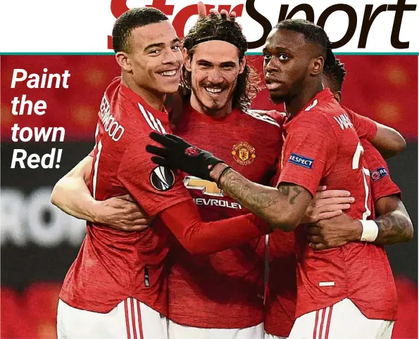  ?? —AFP ?? Manchester United’s Edinson Cavani (centre) celebrates with Mason Greenwood and Aaron Wan-Bissaka (right) after scoring against Granada in their Europa league quarter-final, second-leg match at Old Trafford. United advanced 4-0 on aggregate.