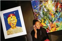  ?? CURTIS COMPTON/ CURTIS. COMPTON@ AJC. COM ?? Lakeysha Hallmon works to open her store, The Village at Ponce City Market in Atlanta, which will include curated artwork from Zucot Gallery for sale. “I want to advance and position Black businesses to engage new markets,” she said.