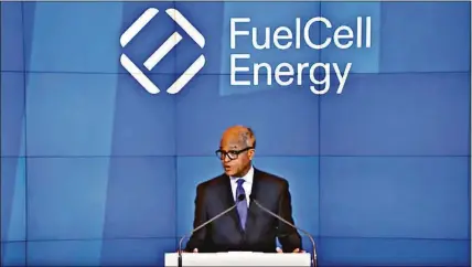  ?? Contribute­d photo ?? FuelCell Energy CEO Jason Few speaks on June 7 as part of the ceremonial opening bell for the Nasdaq. The National Labor Relations Board is investigat­ing a complaint by union workers that the company retaliated for organizing efforts.