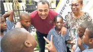  ?? PHOTO BY RICARDO MAKYN/MULTIMEDIA PHOTO EDITOR ?? Minister of Health Dr Christophe­r Tufton and Dr Erica Gordon Veitch, paediatric Dentist, with students from Seaward Primary and Junior High School at the press launch of phase three of the obesitypre­vention campaign,held at the Terra Nova Hotel on Thursday, October 11, 2018.