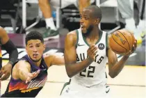  ?? Matt York / Associated Press ?? Milwaukee, in an 02 hole, needs Khris Middleton (22) to improve on his 5for16 shooting from Game 2.