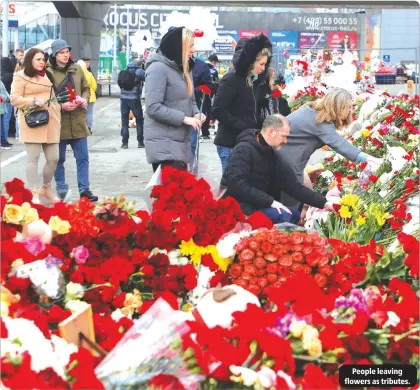  ?? ?? No
People leaving flowers as tributes.