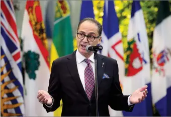  ?? CP PHOTO SEAN KILPATRICK ?? Alberta Finance Minister Joe Ceci talks to reporters Monday in Ottawa prior to a meeting with Finance Minister Bill Morneau and fellow provincial and territoria­l counterpar­ts.