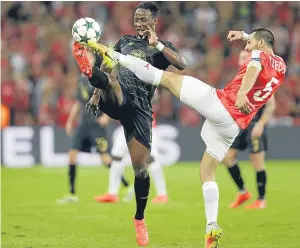  ?? Pictures: AP. ?? Above: Leigh Griffiths is closed down by Hapoel’s Miguel Vitor; right: Griffiths celebrates with captain Scott Brown after Celtic’s place in tomorrow’s draw was confirmed by the final whistle; left: Celtic substitute Moussa Dembele battles it out with...