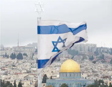  ?? ODED BALILTY / THE ASSOCIATED PRESS ?? A view of Jerusalem’s Old City as seen from the Mount of Olives. U.S. President Donald Trump on Wednesday formally recognized Jerusalem as Israel’s capital, defying warnings from other Middle East countries and sparking outrage.