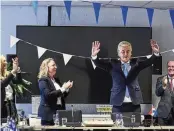  ?? PHIL NIJHUIS / AP ?? Far-right Party for Freedom leader Geert Wilders (second from right) celebrates after winning a general election, in The Hague, Netherland­s, on Thursday. The party won 37 seats in the Dutch parliament.