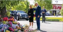  ?? ANDREW HARNIK/AP ?? President Joe Biden and first lady Jill Biden visit Tuesday the scene of a shoot-ing at a supermarke­t to pay respects and speak to families of the victims of Saturday’s shooting in Buffalo, N.Y.