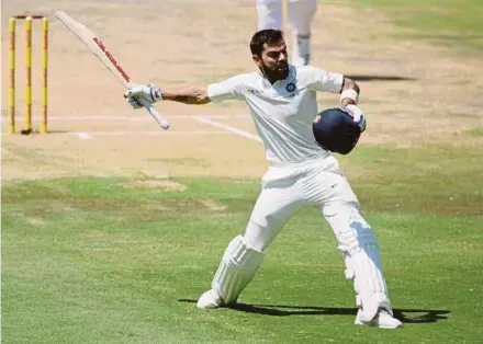  ?? REUTERS PIC ?? India captain Virat Kohli celebrates getting his century against South Africa yesterday.