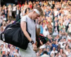  ??  ?? Shapovalov leaves the court in tears after losing to Djokovic during