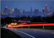  ?? (AP/Michael Probst) ?? Banking district buildings are shown during the Monday morning commute in Frankfurt, Germany.