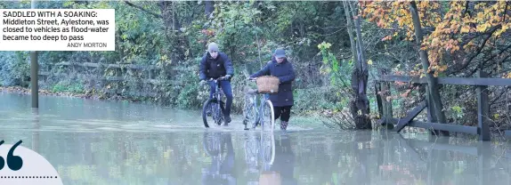  ?? ANDY MORTON ?? SADDLED WITH A SOAKING: Middleton Street, Aylestone, was closed to vehicles as flood-water became too deep to pass