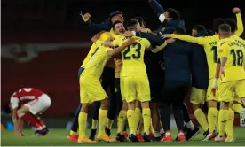  ??  ?? Villarreal players celebrate a famous victory as Arsenal rue their Europa League semifinal exit. Photograph: Tom Jenkins/The Guardian