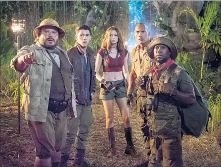  ?? Frank Masi Sony Pictures ?? JACK BLACK, left, Nick Jonas, Karen Gillan, Dwayne Johnson and Kevin Hart in “Jumanji,” which has hit $768 million in ticket sales.