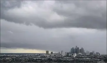  ?? Brian van der Brug Los Angeles Times ?? STORM CLOUDS roll over the Los Angeles Basin on Nov. 27. Southern California got an unusually early start on rain season this year; most of the rain that drenches the Southland occurs in January, February and March.