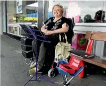  ?? EWAN SARGENT/STUFF ?? Marion Hounsome doesn’t let her multiple sclerosis stop her busking in Christchur­ch.