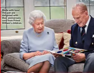  ??  ?? Made with love! The pair are delighted with their anniversar­y card from Prince William’s children.