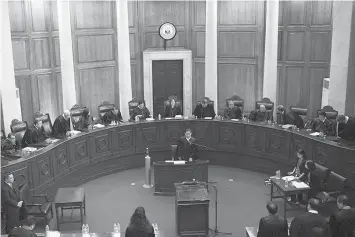  ?? AGENCE FRANCE PRESSE ?? Members of the Supreme Court of the Philippine­s, led by its newly-appointed Chief Justice Teresita de Castro (back C), hear oral arguments on the petition to quit the Internatio­nal Criminal Court, at the Supreme Court in Manila.