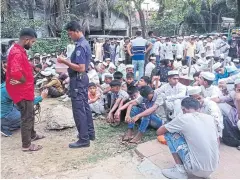  ?? AFP ?? A policeman takes the details of Rohingya refugees detained from a beach, at the Sadar Model police station in Cox’s Bazar, Bangladesh on Wednesday.