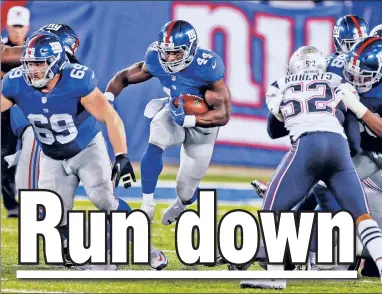  ?? USA TODAY Sports ?? CHOPPING BLOCK: Running back Andre Williams, carrying the ball Thursday against the Patriots, did not survive Saturday’s roster cuts, as the Giants moved on from the 2014 fourth-round pick.