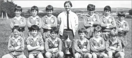  ??  ?? Georgie O’Callaghan with the Castleisla­nd AFC team prior to their departure on the club’s fifth annual tour of English clubs in August 1982 with visits to Wembley Stadium, Queens Park Rangers, Tottenham Hotspur and Arsenal planned.