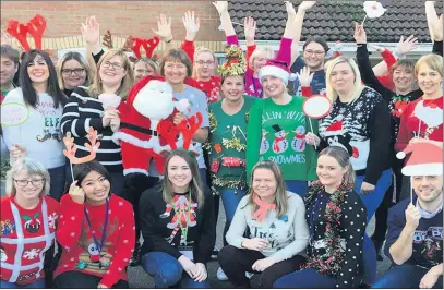  ??  ?? Staff and volunteers don their Christmas jumpers in support of the Donna Louise festive appeal.