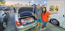  ?? Findlay ?? Miguel and Stephanie Landrove made a large donation of pajamas at Findlay Volkswagen Henderson in the Valley Automall.