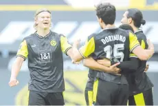  ??  ?? Dortmund’s players including Norwegian forward Erling Braut Haaland (L) celebrate the 4-1 goal during the German first division Bundesliga football match between Borussia Dortmund and SV Werder Bremen in Dortmund, western Germany, on April 18, 2021. - AFP photo