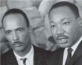  ??  ?? The Rev. Martin Luther King Jr. ( right) and Albert Raby, a Chicago civil rights leader, speak in Chicago on Aug. 26, 1966.
| AP FILE PHOTO