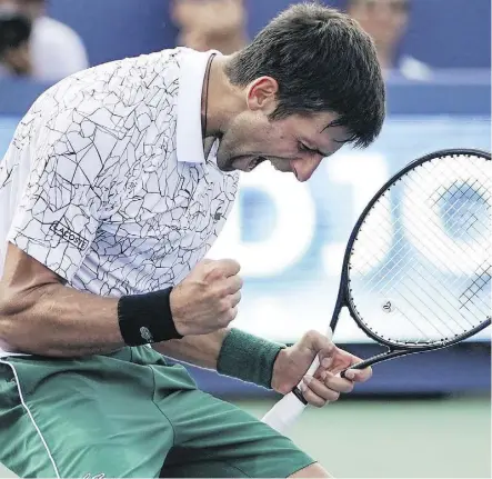  ?? THE ASSOCIATED PRESS ?? Novak Djokovic reacts after defeating Roger Federer in the men’s singles final at the Western &amp; Southern Open. Djokovic is now 12-6 overall against his old rival in championsh­ip matches.