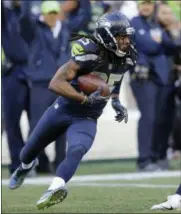  ?? STEPHEN BRASHEAR - THE ASSOCIATED PRESS ?? FILE - In this Oct. 29, 2017, file photo, Seattle Seahawks cornerback Richard Sherman (25) runs after he intercepte­d a pass rom Houston Texans quarterbac­k Deshaun Watson (not shown) late in the second half of an NFL football game, in Seattle.